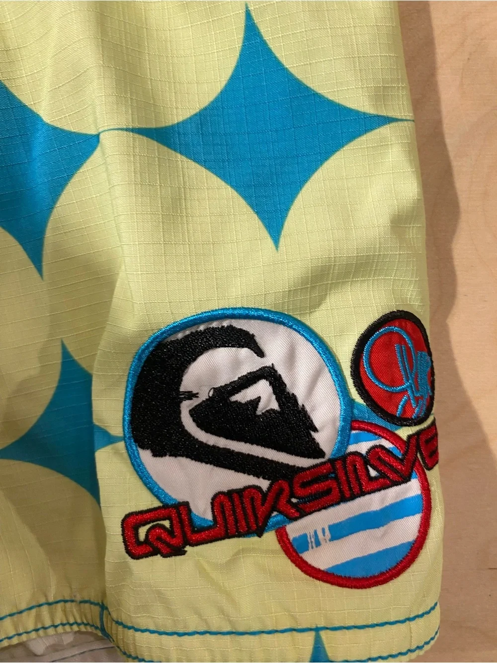 QuikSilver Red, Blue & Yellow Patterned Board Shorts 38 (BM)